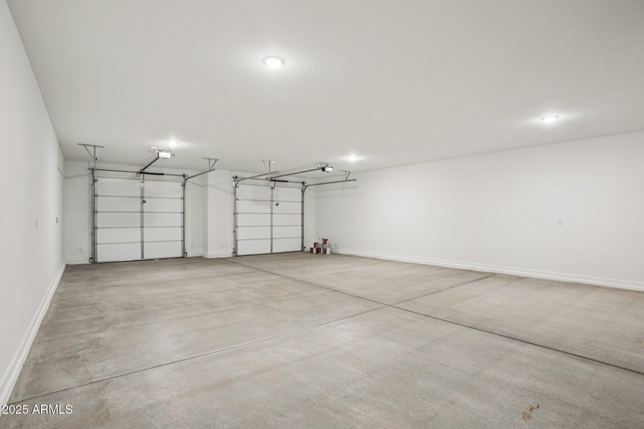 15723 West Brown Street Waddell, AZ 85355 - Photo 28 of 51 an empty room with a empty space and a chandelier fan