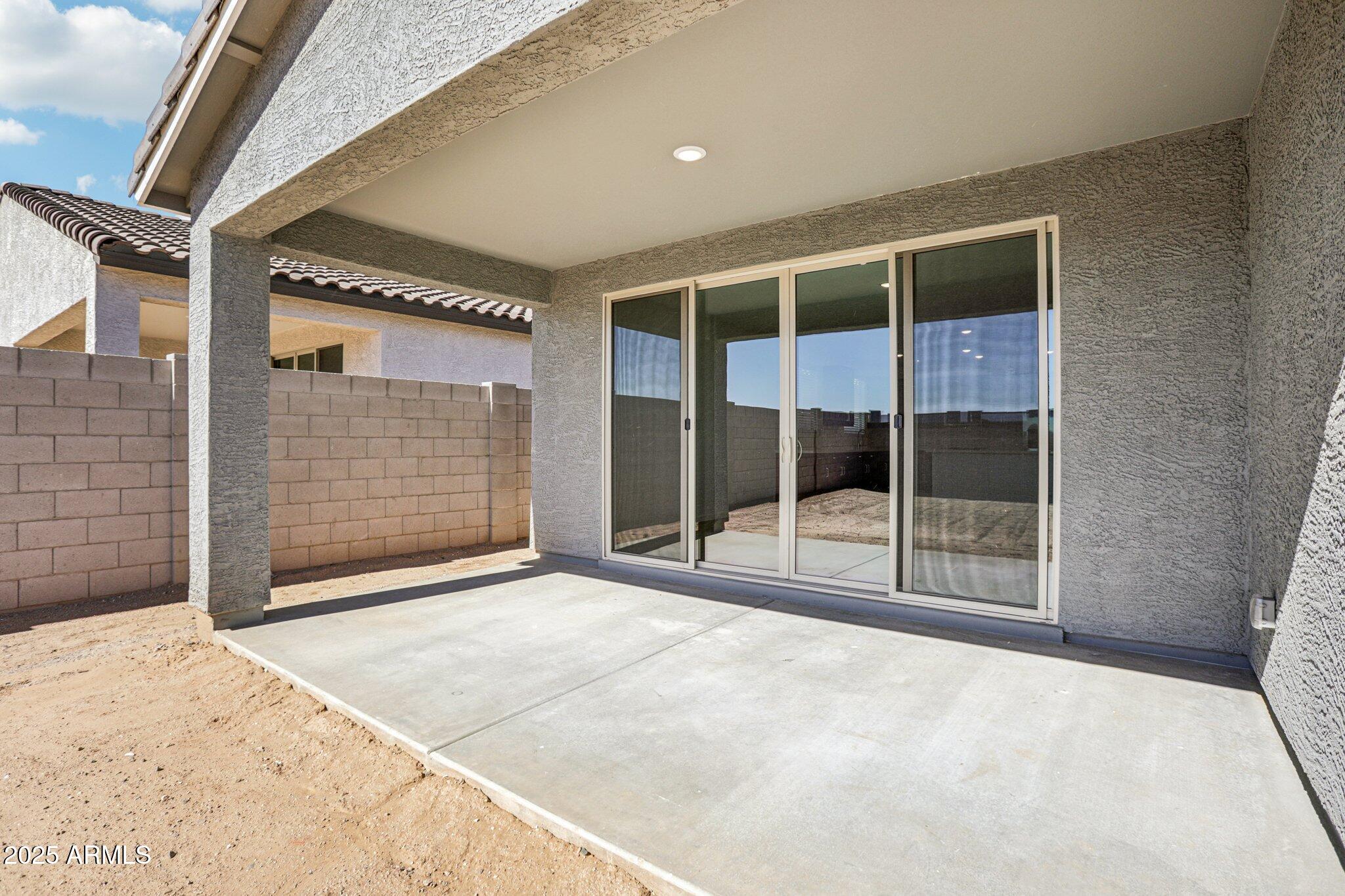 15723 West Brown Street Waddell, AZ 85355 - Photo 30 of 51 a view of an empty room with wooden floor and fence