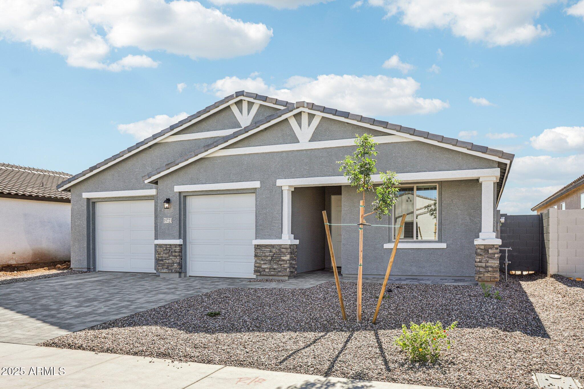 15723 West Brown Street Waddell, AZ 85355 - Photo 3 of 51 a front view of a house with garden
