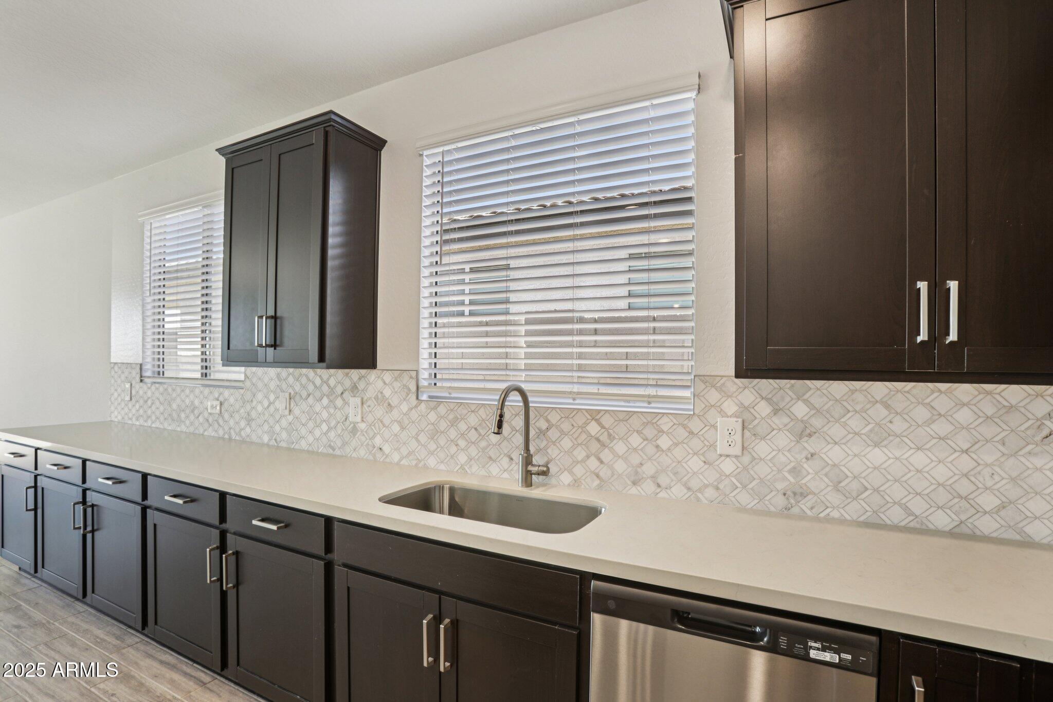 15723 West Brown Street Waddell, AZ 85355 - Photo 10 of 51 a bathroom with a sink and a mirror