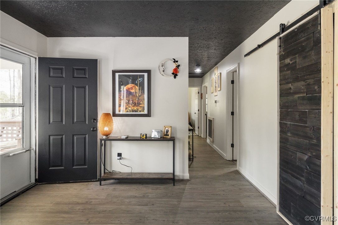 170 Faucetts Road Tappahannock, VA 22560 - Photo 12 of 48 a view of a hallway with wooden floor and a cabinet