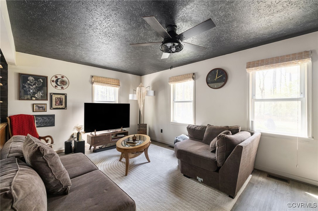 170 Faucetts Road Tappahannock, VA 22560 - Photo 16 of 48 a living room with furniture and a flat screen tv