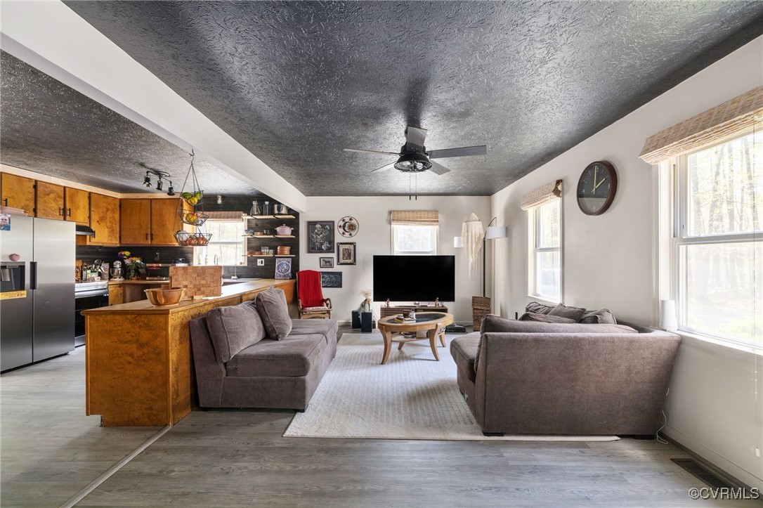 170 Faucetts Road Tappahannock, VA 22560 - Photo 2 of 48 a living room with furniture and a flat screen tv