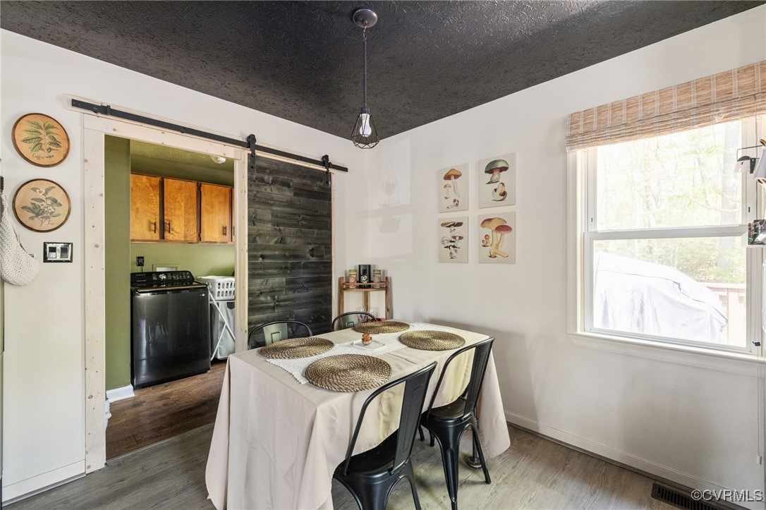 170 Faucetts Road Tappahannock, VA 22560 - Photo 25 of 48 a dining room with a window and a wooden floor