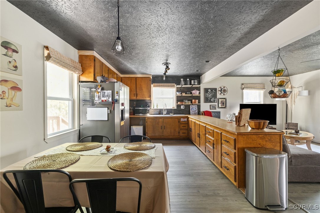 170 Faucetts Road Tappahannock, VA 22560 - Photo 26 of 48 a kitchen with stainless steel appliances kitchen island granite countertop a table chairs in it and a window