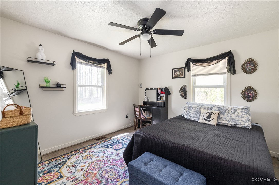 170 Faucetts Road Tappahannock, VA 22560 - Photo 32 of 48 a bedroom with a bed and a window