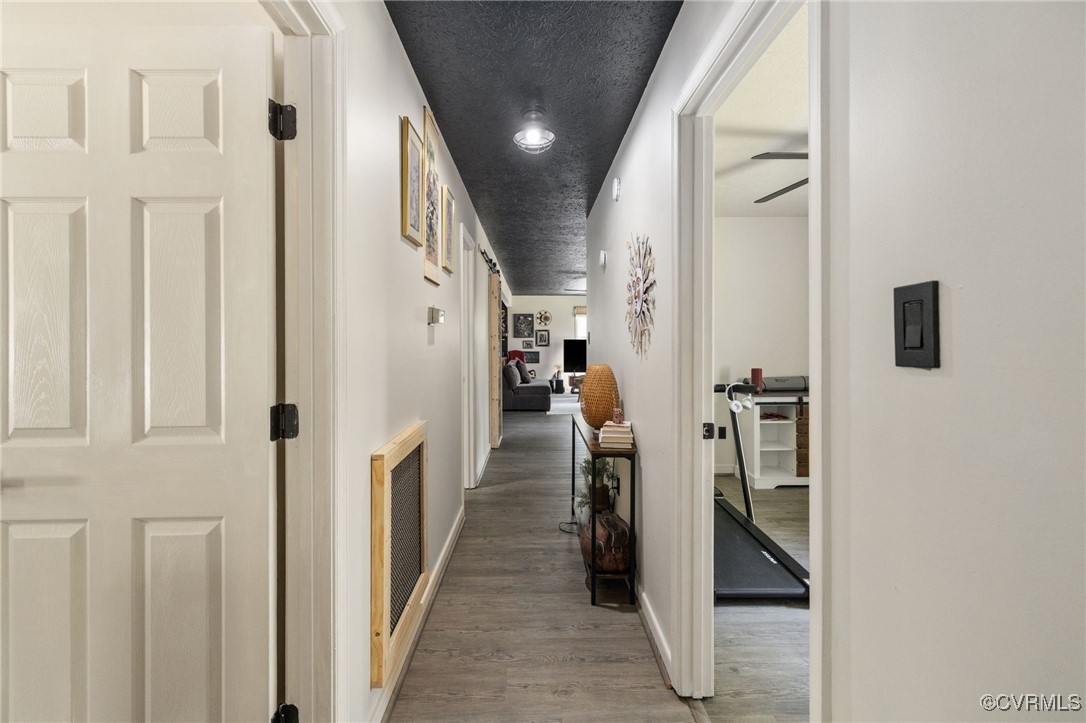 170 Faucetts Road Tappahannock, VA 22560 - Photo 37 of 48 a hallway with white cabinets and washer