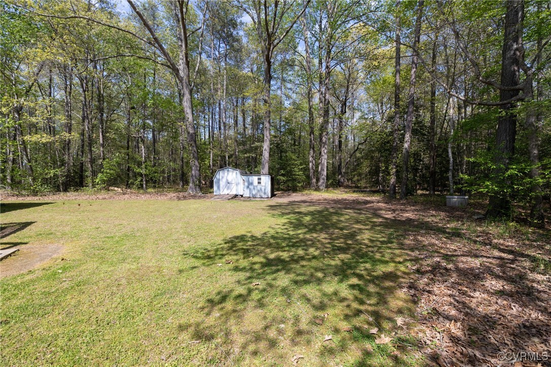 170 Faucetts Road Tappahannock, VA 22560 - Photo 44 of 48 a view of outdoor space with trees