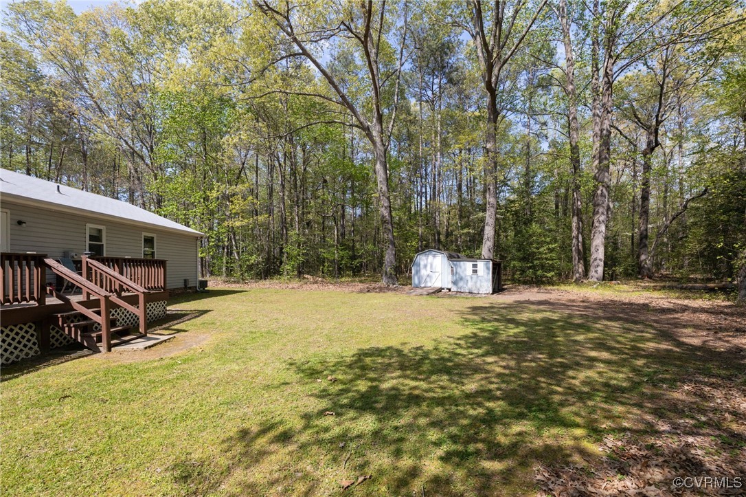 170 Faucetts Road Tappahannock, VA 22560 - Photo 46 of 48 a house with trees in front of it