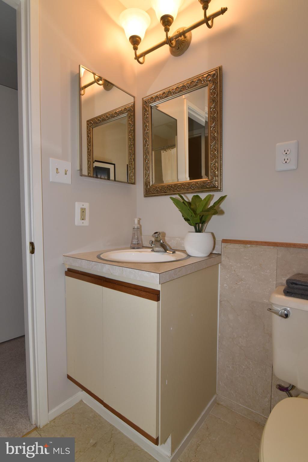 11117 Glade Drive Reston, VA 20191 - Photo 66 of 75 Lower level full hall bathroom vanity & new light!