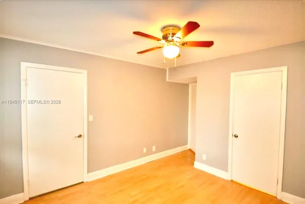 a view of a big room with a door