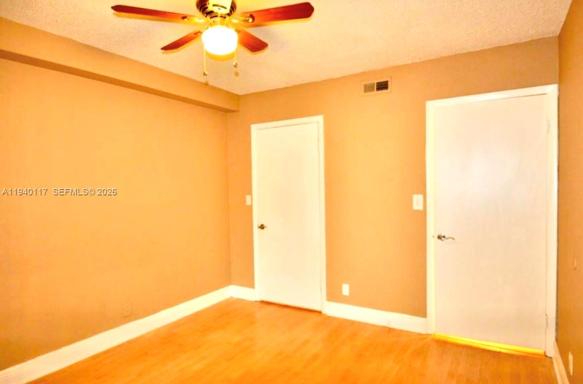 5654 Rock Island Road, Unit 214 Tamarac, FL 33319 - Photo 12 of 26 a view of a big room with a door