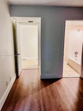 a view of a kitchen with a sink dishwasher and a refrigerator