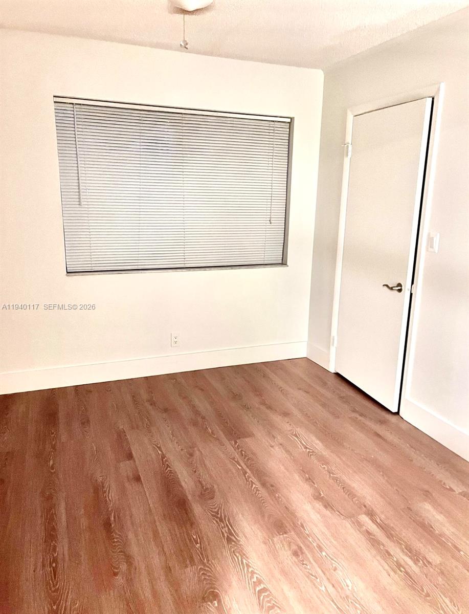 5654 Rock Island Road, Unit 214 Tamarac, FL 33319 - Photo 18 of 26 a view of a room with wooden floor