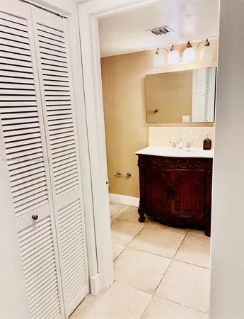an empty room with a ceiling fan and a window