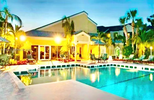 a view of an ocean with a swimming pool