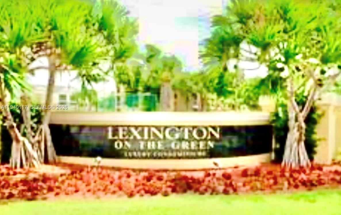 5654 Rock Island Road, Unit 214 Tamarac, FL 33319 - Photo 8 of 26 a street sign is sitting in front of house with yard