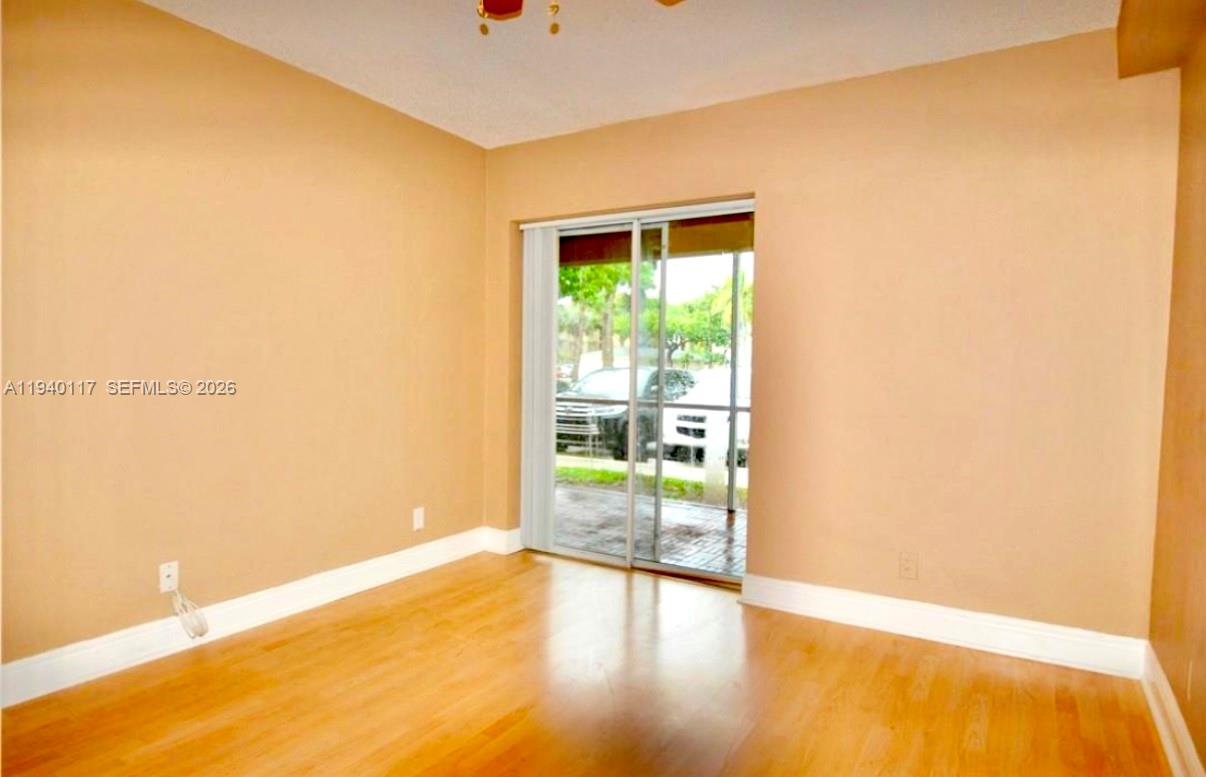 5654 Rock Island Road, Unit 214 Tamarac, FL 33319 - Photo 9 of 26 a view of an empty room with a window