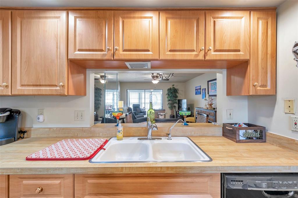 2700 Nebraska Avenue, Unit 3201 Palm Harbor, FL 34684 - Photo 11 of 50 a kitchen with stainless steel appliances granite countertop a sink and cabinets