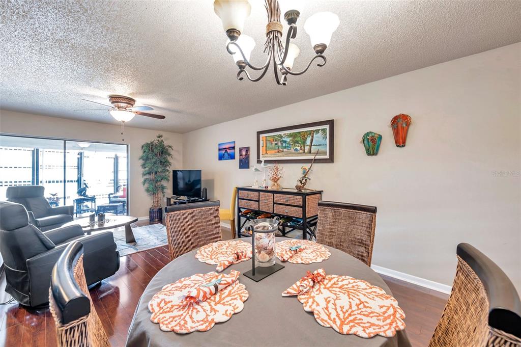 2700 Nebraska Avenue, Unit 3201 Palm Harbor, FL 34684 - Photo 16 of 50 a living room with furniture and a chandelier