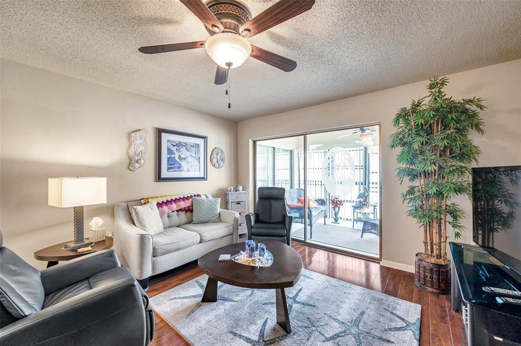 2700 Nebraska Avenue, Unit 3201 Palm Harbor, FL 34684 - Photo 18 of 50 a living room with furniture a flat screen tv and a window