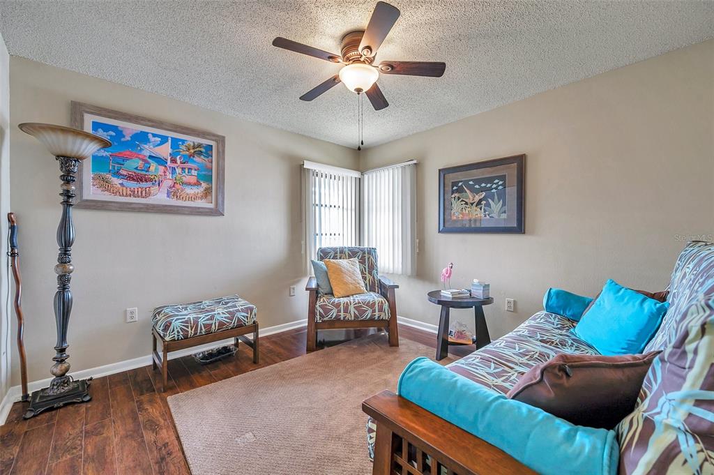 2700 Nebraska Avenue, Unit 3201 Palm Harbor, FL 34684 - Photo 27 of 50 a living room with furniture and a chandelier