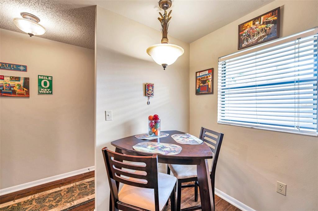 2700 Nebraska Avenue, Unit 3201 Palm Harbor, FL 34684 - Photo 3 of 50 a dining room with furniture and window