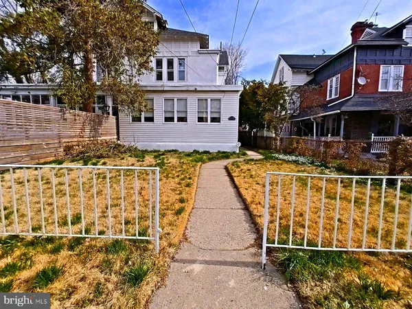 a front view of a house with swimming pool