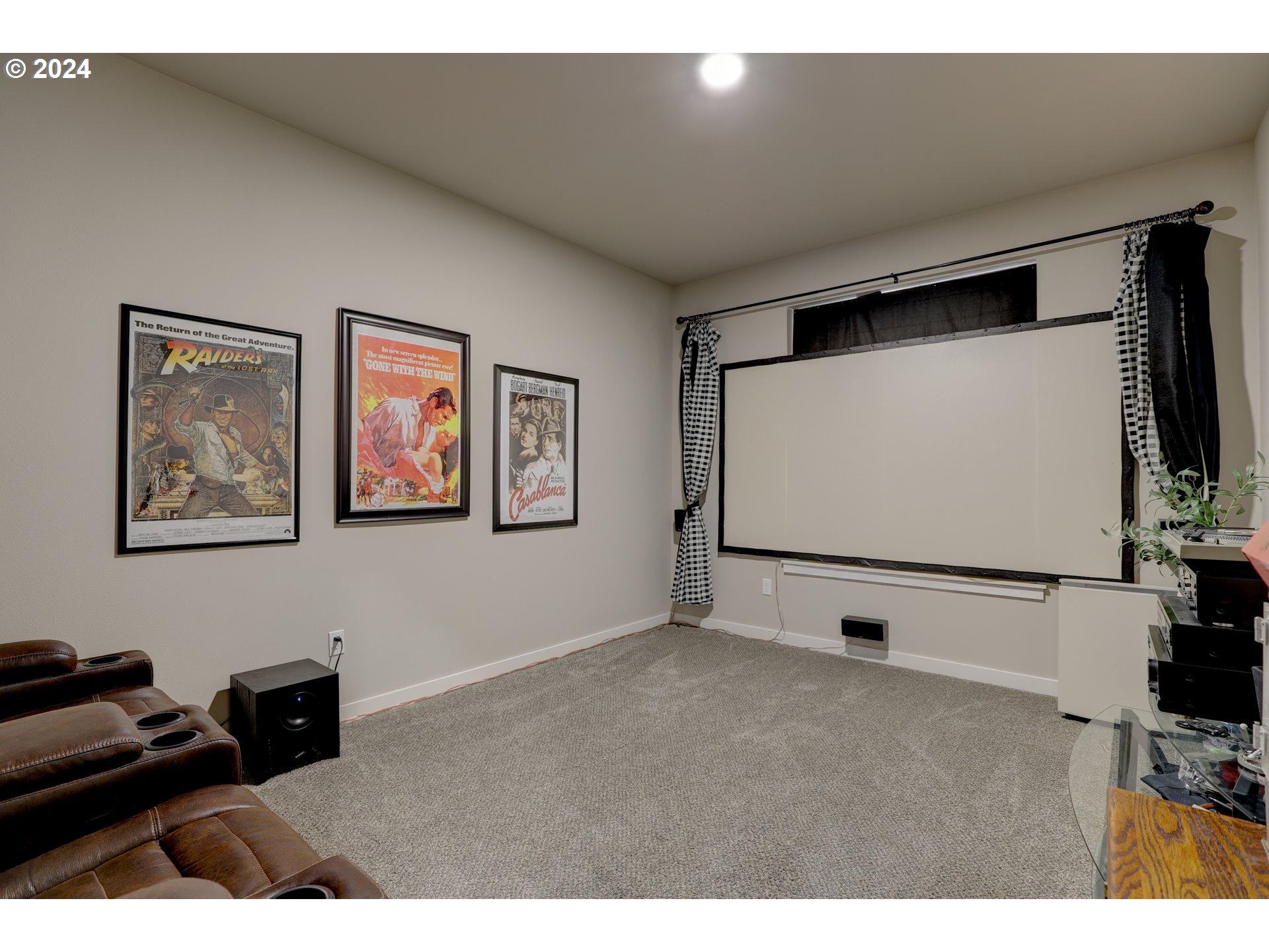 700 Dooley Road Centerville, WA 98613 - Photo 11 of 47 a living room with wall paintings and a flat screen tv