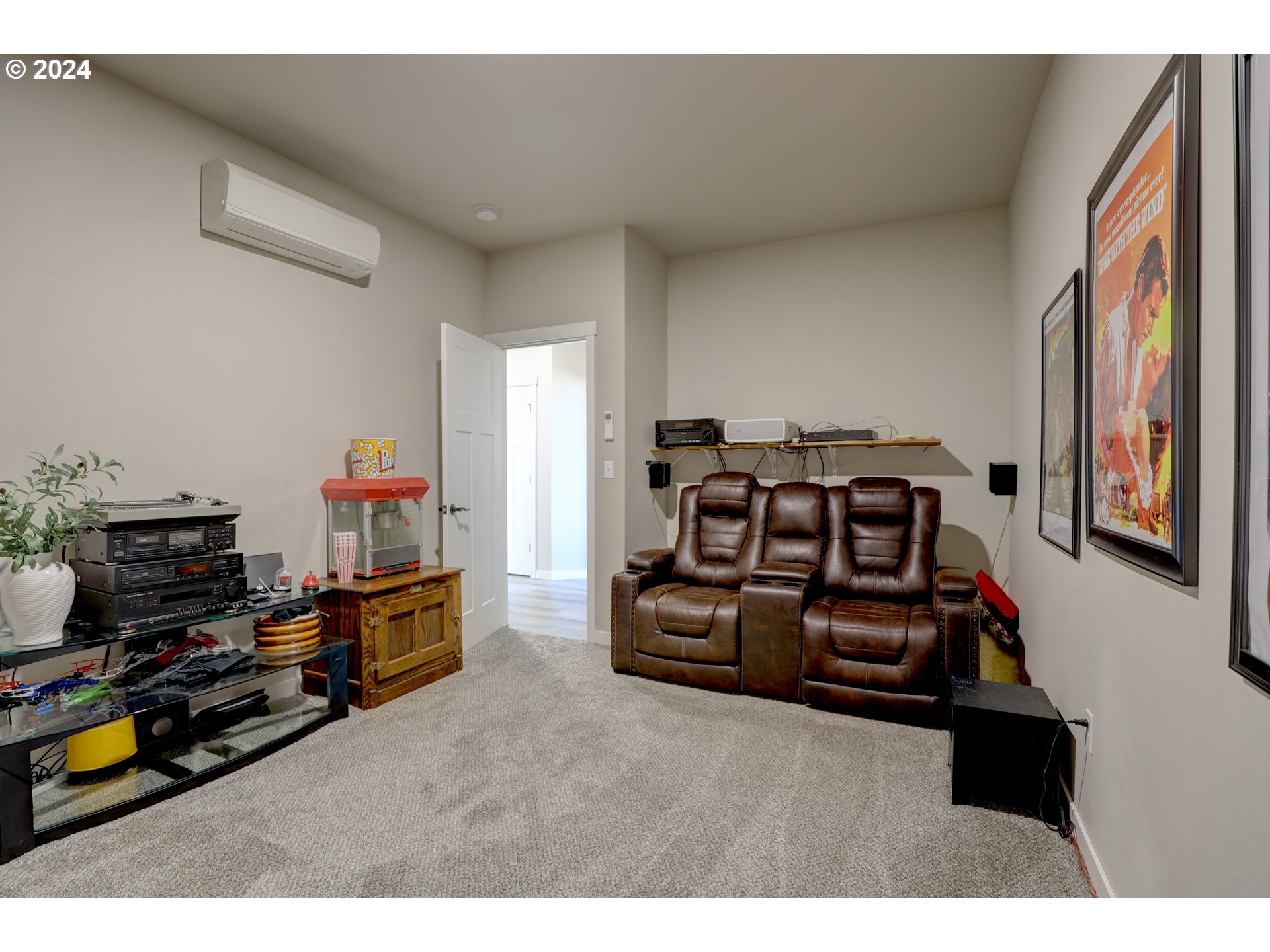 700 Dooley Road Centerville, WA 98613 - Photo 12 of 47 a living room with furniture a flat screen tv and gym equipment