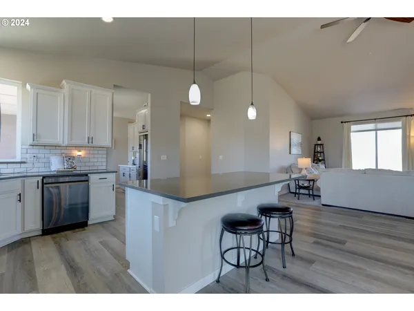a kitchen with a table and chairs