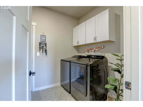 a kitchen with a refrigerator and cabinets