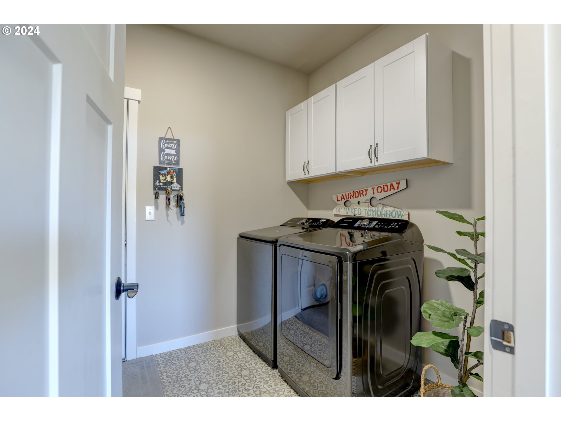 700 Dooley Road Centerville, WA 98613 - Photo 27 of 47 a kitchen with a refrigerator and cabinets