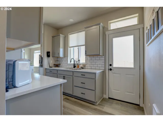 a kitchen with cabinets appliances and a counter top