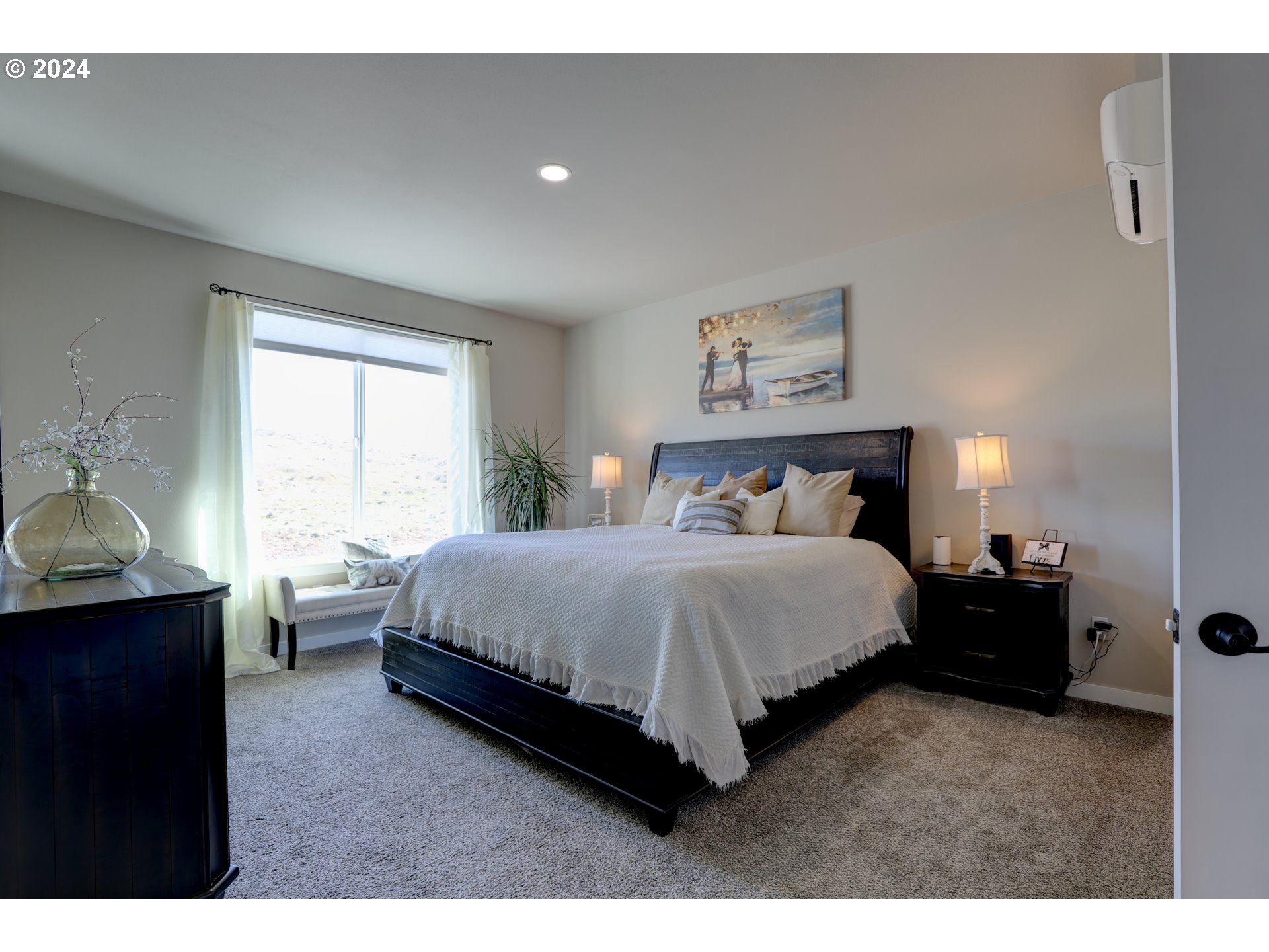 700 Dooley Road Centerville, WA 98613 - Photo 31 of 47 a spacious bedroom with a bed and window