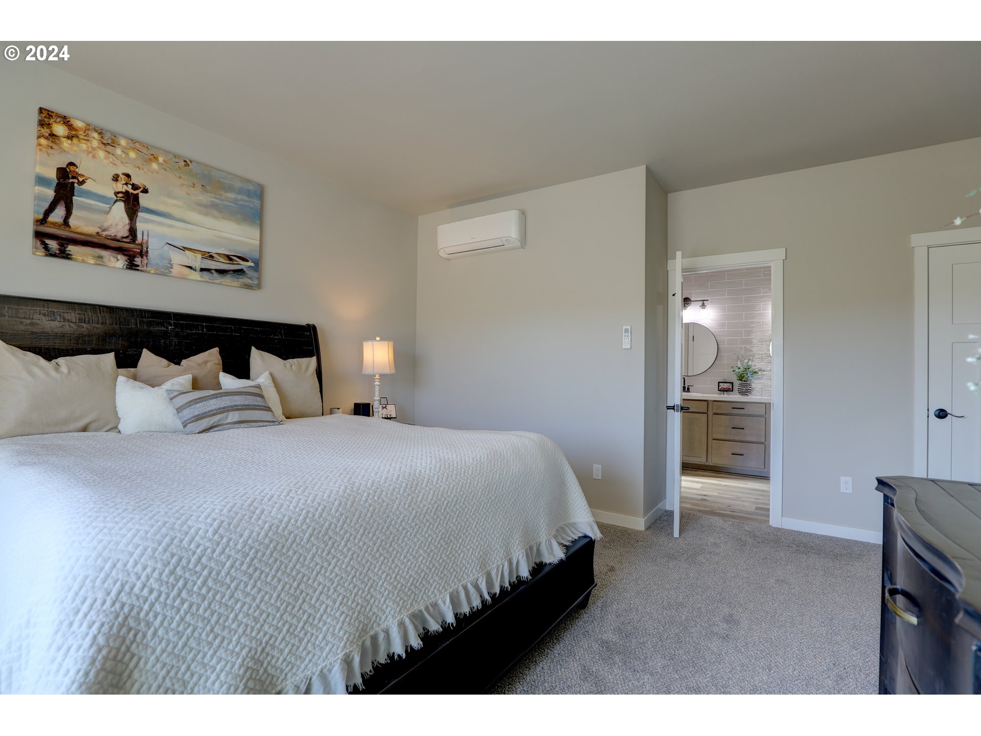 700 Dooley Road Centerville, WA 98613 - Photo 33 of 47 a bedroom with a bed and a view of bathroom