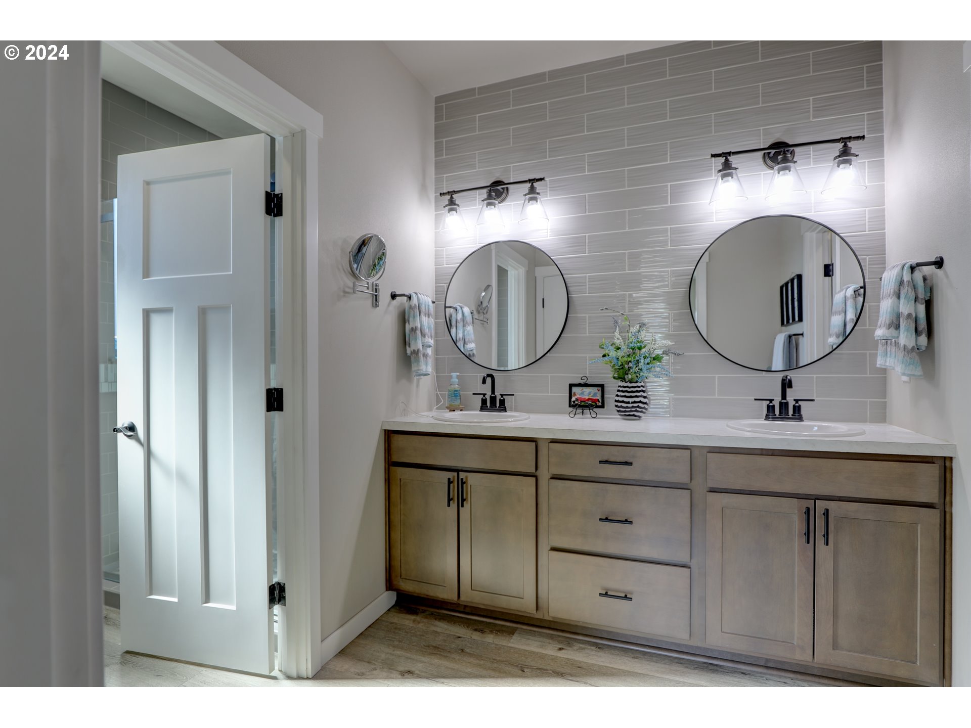 700 Dooley Road Centerville, WA 98613 - Photo 34 of 47 a bathroom with a double vanity sink and a mirror