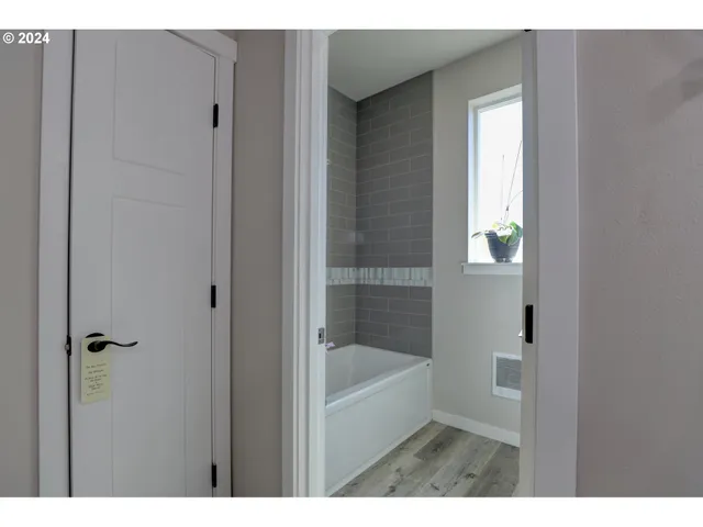 a bathroom with a shower and a tub
