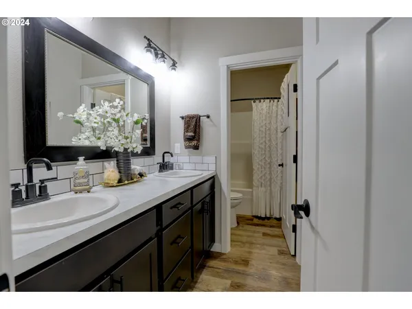 a bathroom with a double vanity sink mirror and double