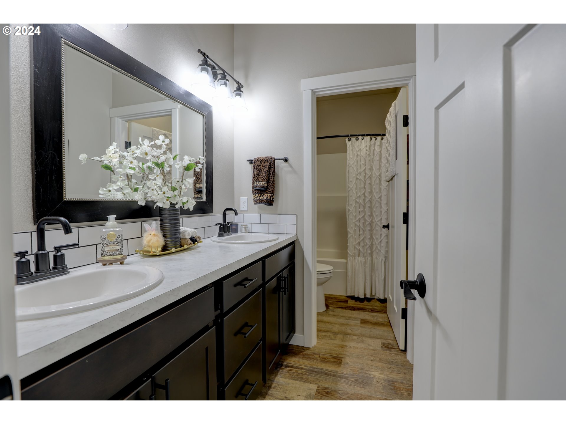700 Dooley Road Centerville, WA 98613 - Photo 9 of 47 a bathroom with a double vanity sink mirror and double