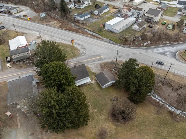 an aerial view of a house with outdoor space