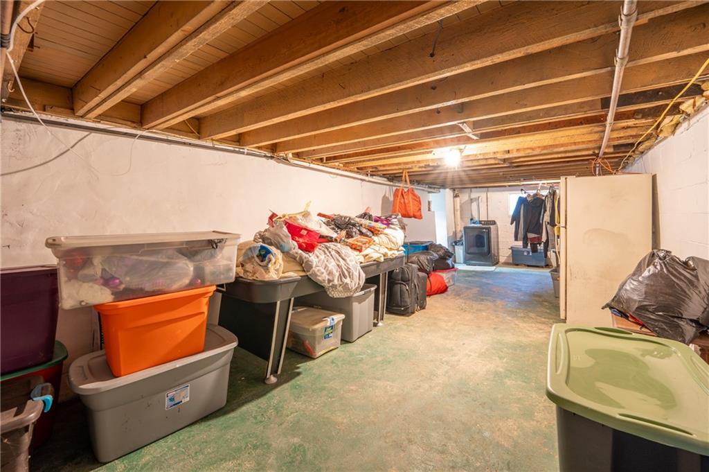 105 Pandora Road Loyalhanna, PA 15661 - Photo 13 of 27 a view of a storage room with furniture and a garage