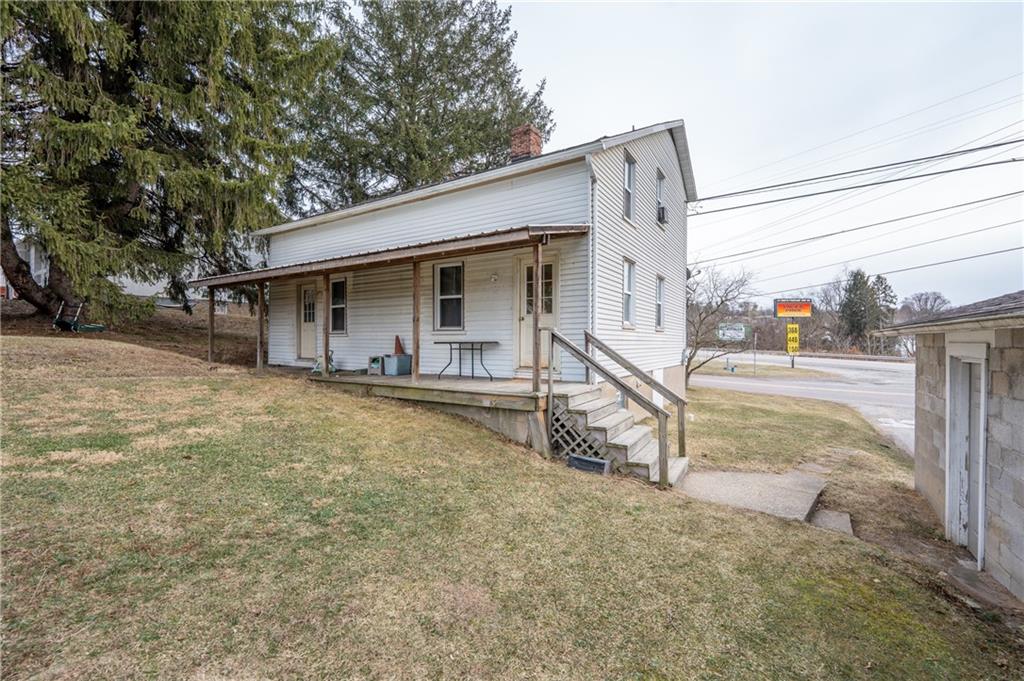 105 Pandora Road Loyalhanna, PA 15661 - Photo 3 of 13 a view of an house with backyard and parking
