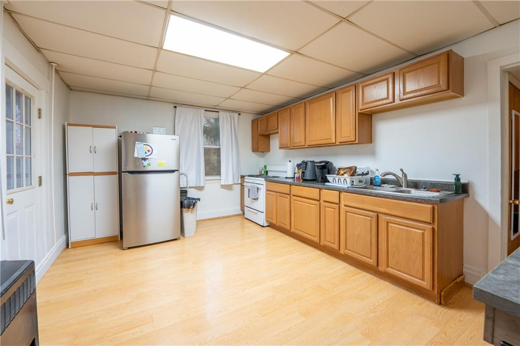 105 Pandora Road Loyalhanna, PA 15661 - Photo 6 of 27 a kitchen with refrigerator cabinets and a sink