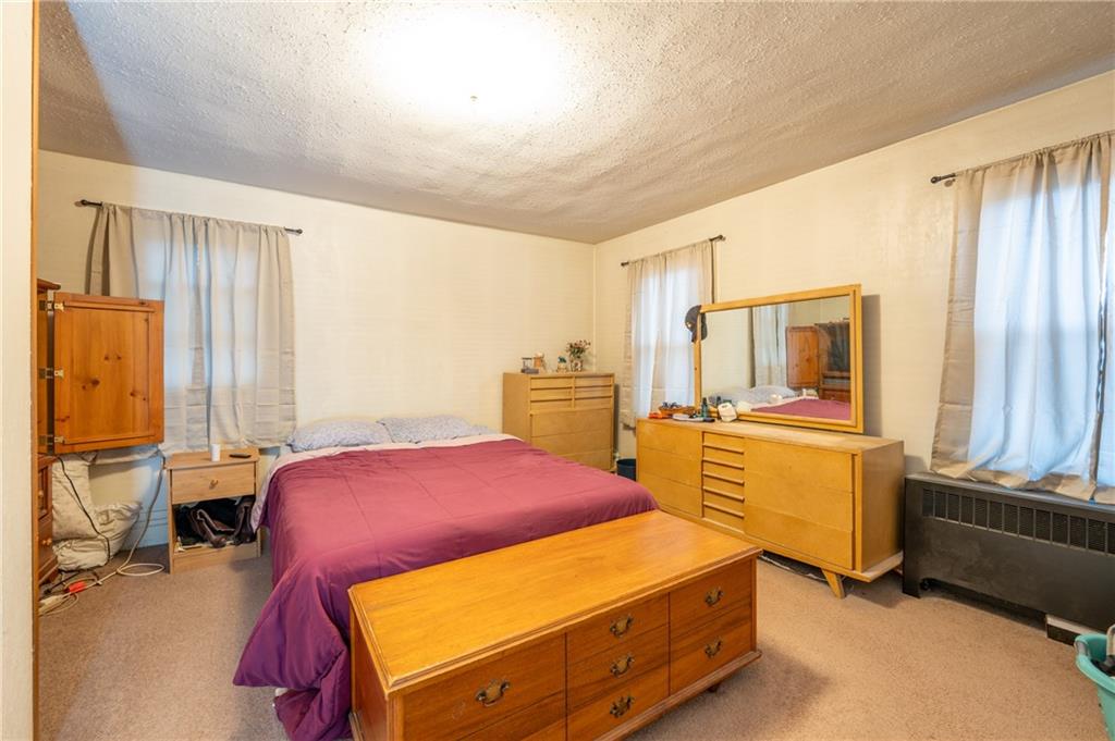 105 Pandora Road Loyalhanna, PA 15661 - Photo 9 of 27 a bedroom with a bed and wooden floor
