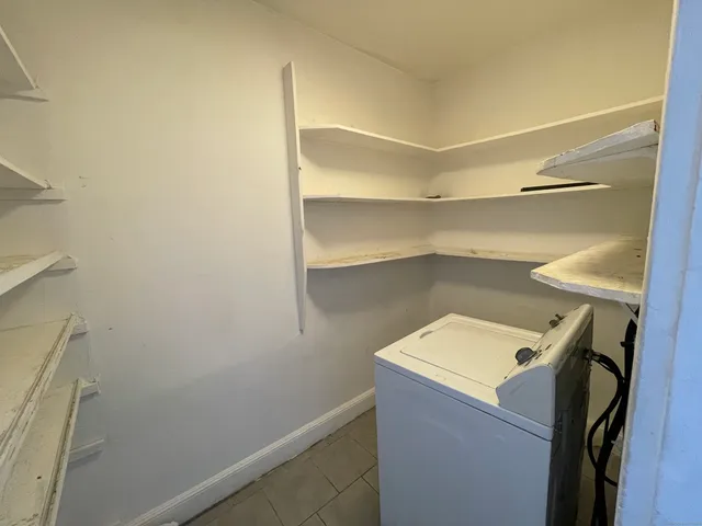 a utility room with washer and dryer