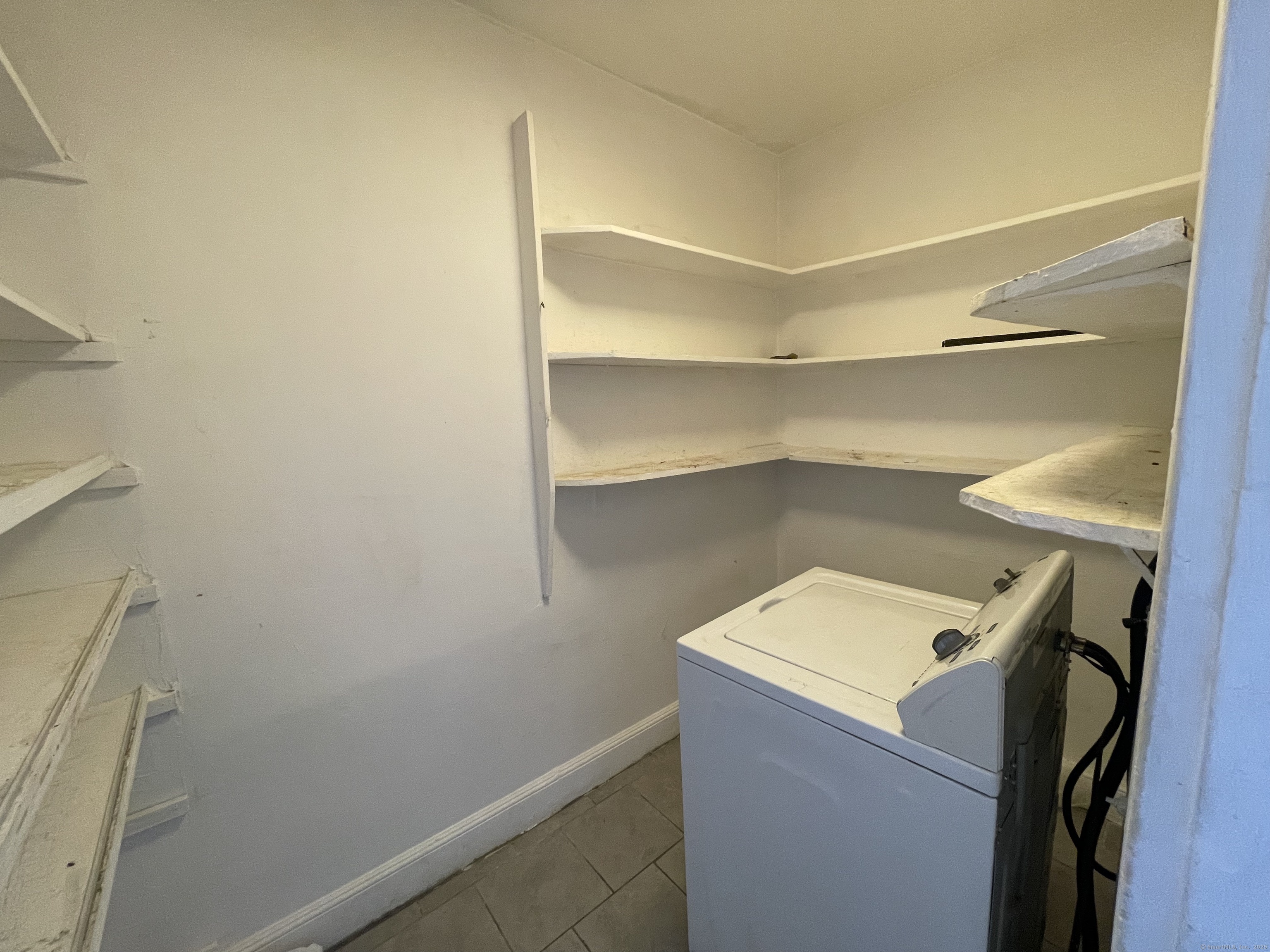 152 Wolcott Street, Unit 2 Waterbury, CT 06705 - Photo 8 of 12 a utility room with washer and dryer