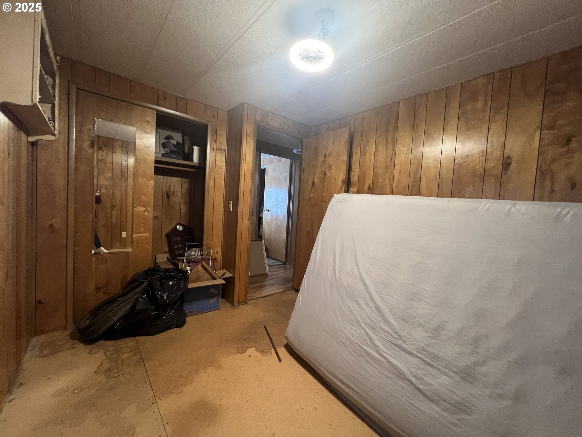 32726 East Punkin Center Road Hermiston, OR 97838 - Photo 15 of 17 a bed room with a bed and a mirror