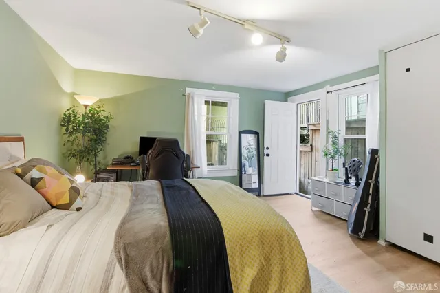 a bed room with a bed and a walk in closet