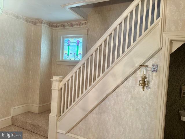 505 McKnight Street Gordon, PA 17921 - Photo 26 of 46 a view of staircase with lots of frames on wall and a window